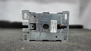 A rectangular metal bracket labeled "C25FNF360A" sits on foam. This bracket is part of the CONTACTOR | EATON | C25FNF360. The bracket has a central hole, side slots, and a blurred background.