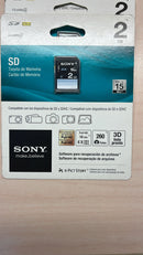 A packaged Sony 2GB SD Card (Class 4, 15MB/s) displays SDHC compatibility, camera and video device icons, Full HD video support, and highlights included file recovery software.